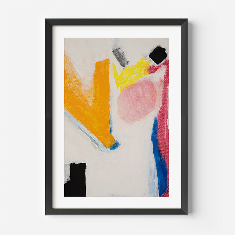 Abstract art print with colorful shapes in a black frame on a white wall