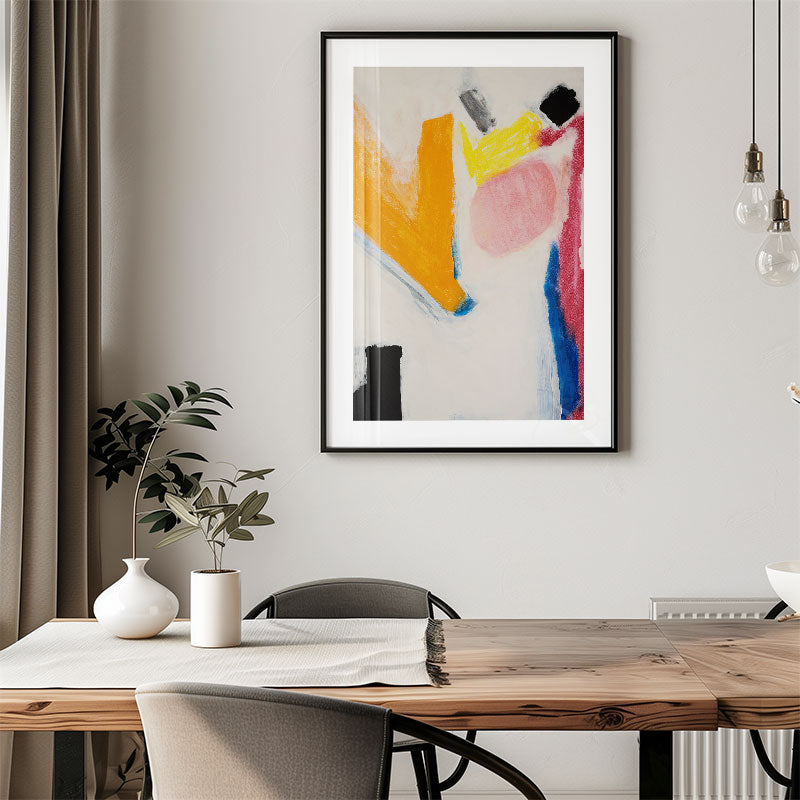Modern interior with a wooden dining table, abstract art on the wall, and decorative elements.