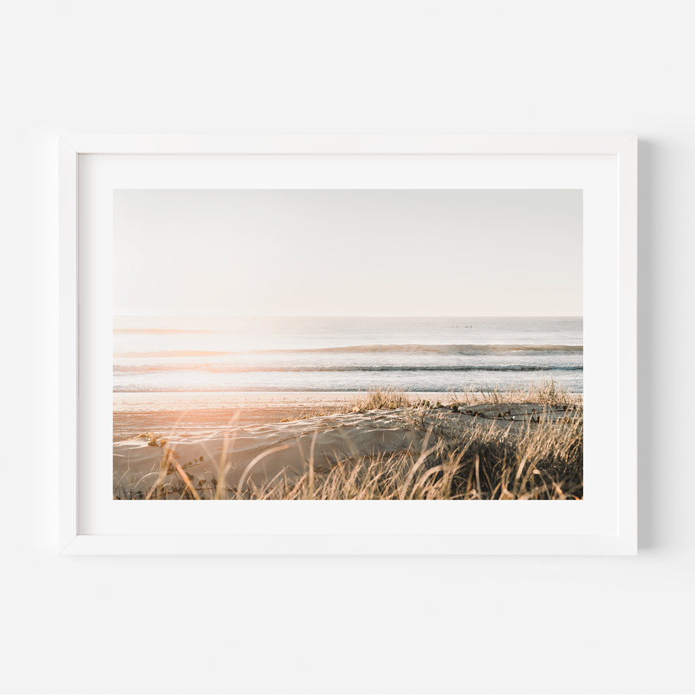 Beach art for wall lovers, showcasing early light over Main Beach with a soft ocean view and warmth