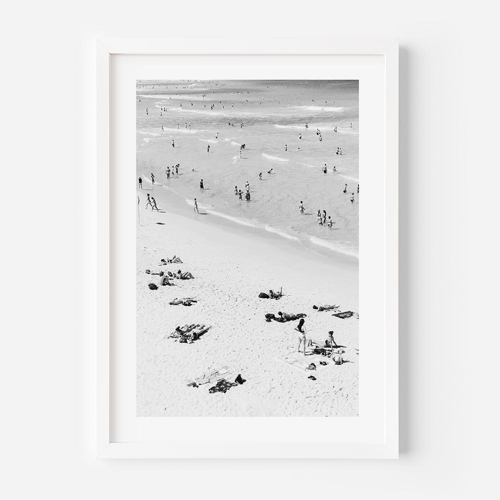 Beachfront Bliss: A framed image of Bondi Beach, featuring vibrant scenes of people soaking up the sun and enjoying the beach atmosphere, perfect for wall art in any beach lover's home.