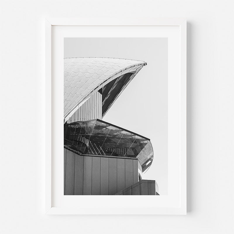 Framed black and white architectural print of a building's roof on a white background