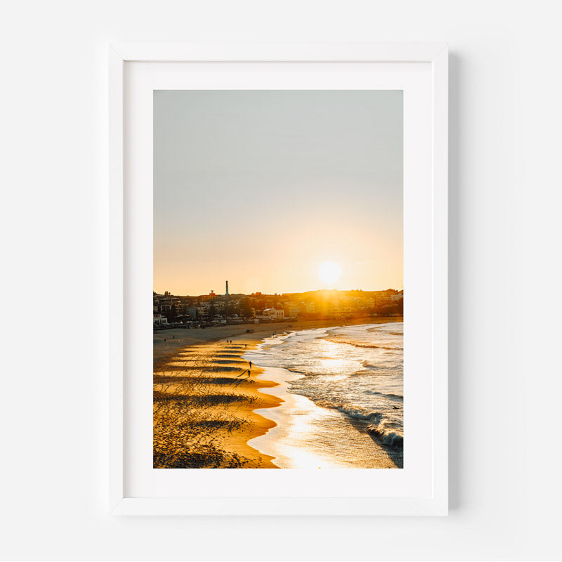 Framed photograph of a beach sunrise with a white frame.