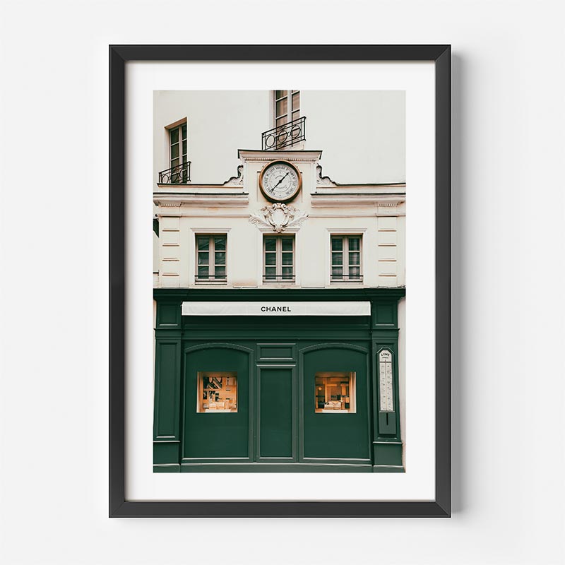 A stunning wall artwork of the Chanel building in Paris, France, with a clock, perfect for adding a touch of sophistication to your space.