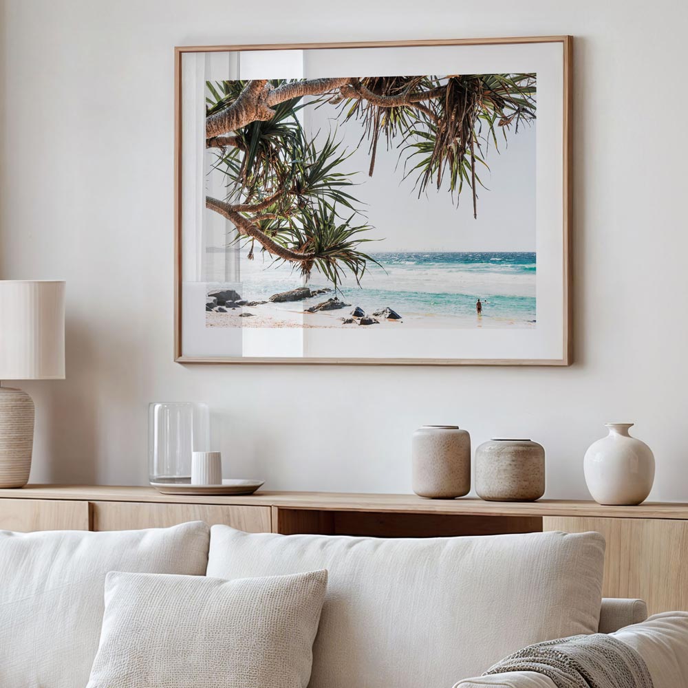 Pandanus tree and blue ocean tones captured in tranquil Rainbow Bay beach scene wall art