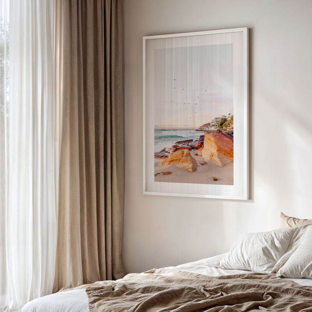 Morning at Rocks Bondi Beach Australia, golden framed photo of beach with birds flying over it.