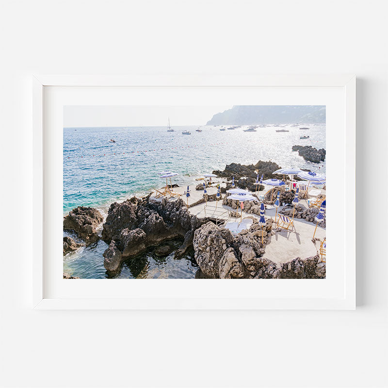 Beach scene with rocky shoreline and ocean view