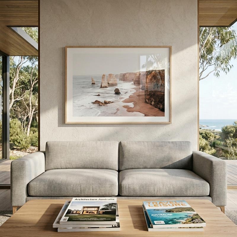 Gray sofa in a modern living room with a large framed picture of a beach.