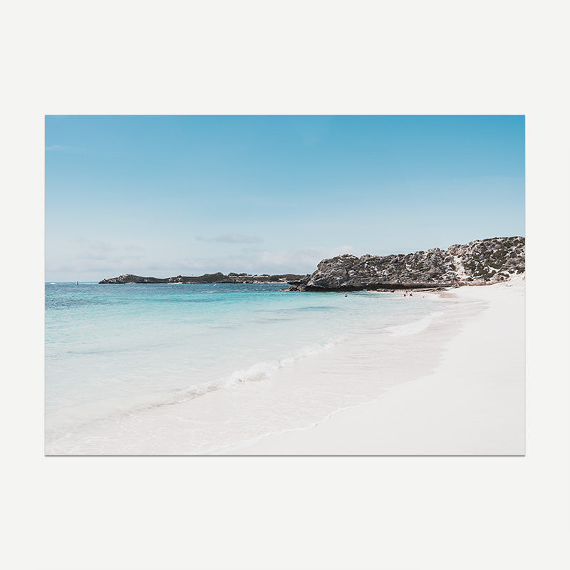 Beach scene with clear blue sky and turquoise water