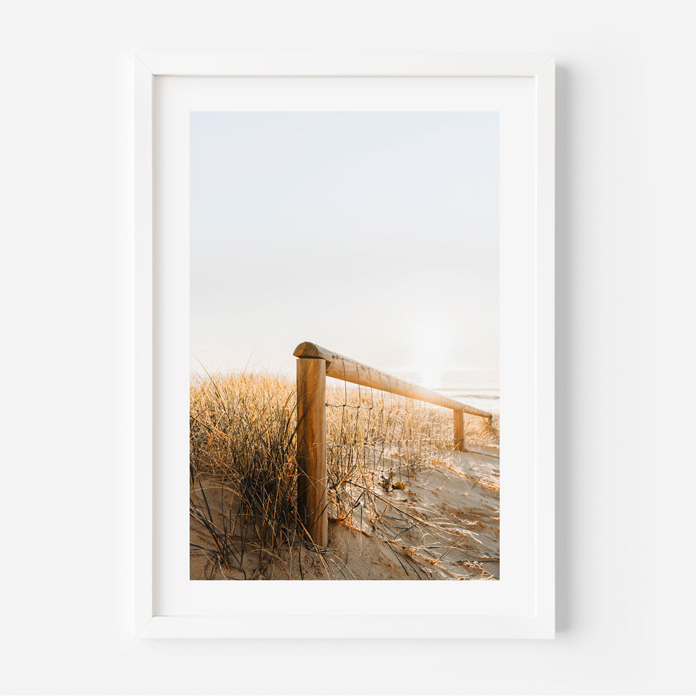 Main Beach entryway wall art with golden morning hues.