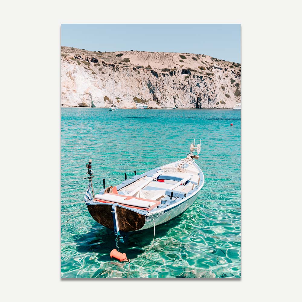 A print of a boat on crystal clear water on greek island