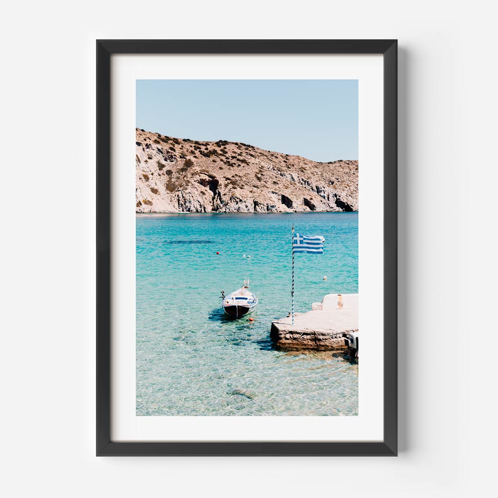 Boat with Greek flag floating on turquoise waters in Firopotamos, Milos – coastal wall art print