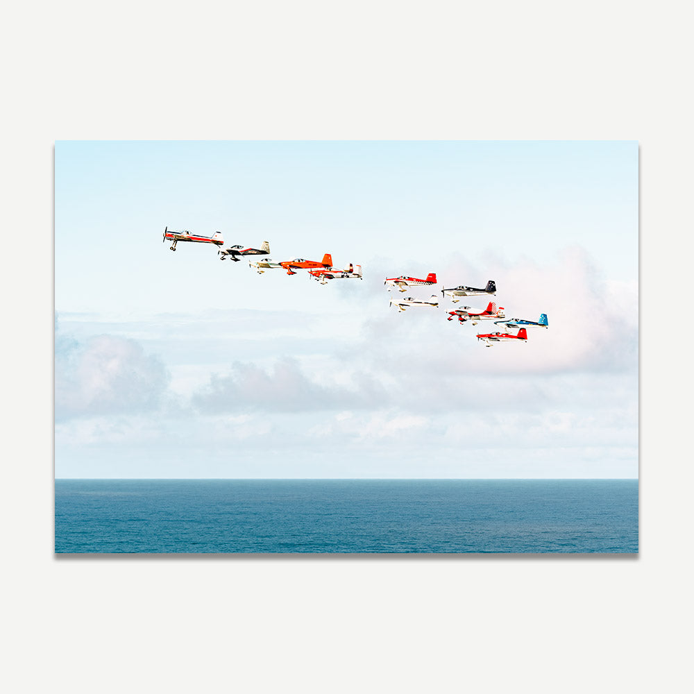 Antique planes flying over the ocean at Gold Coast Airshow