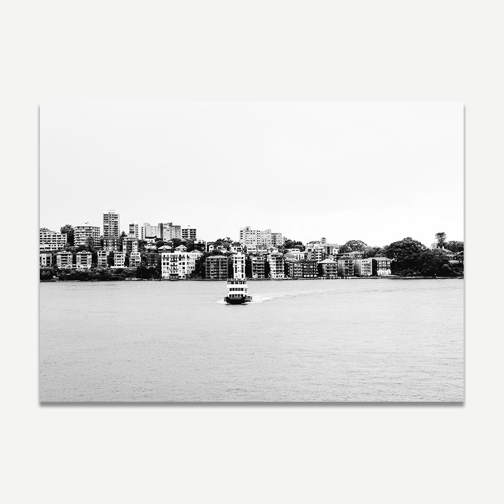 Misty Arrival photography showcasing the calm of the ocean and buildings, with a boat in the misty scene.