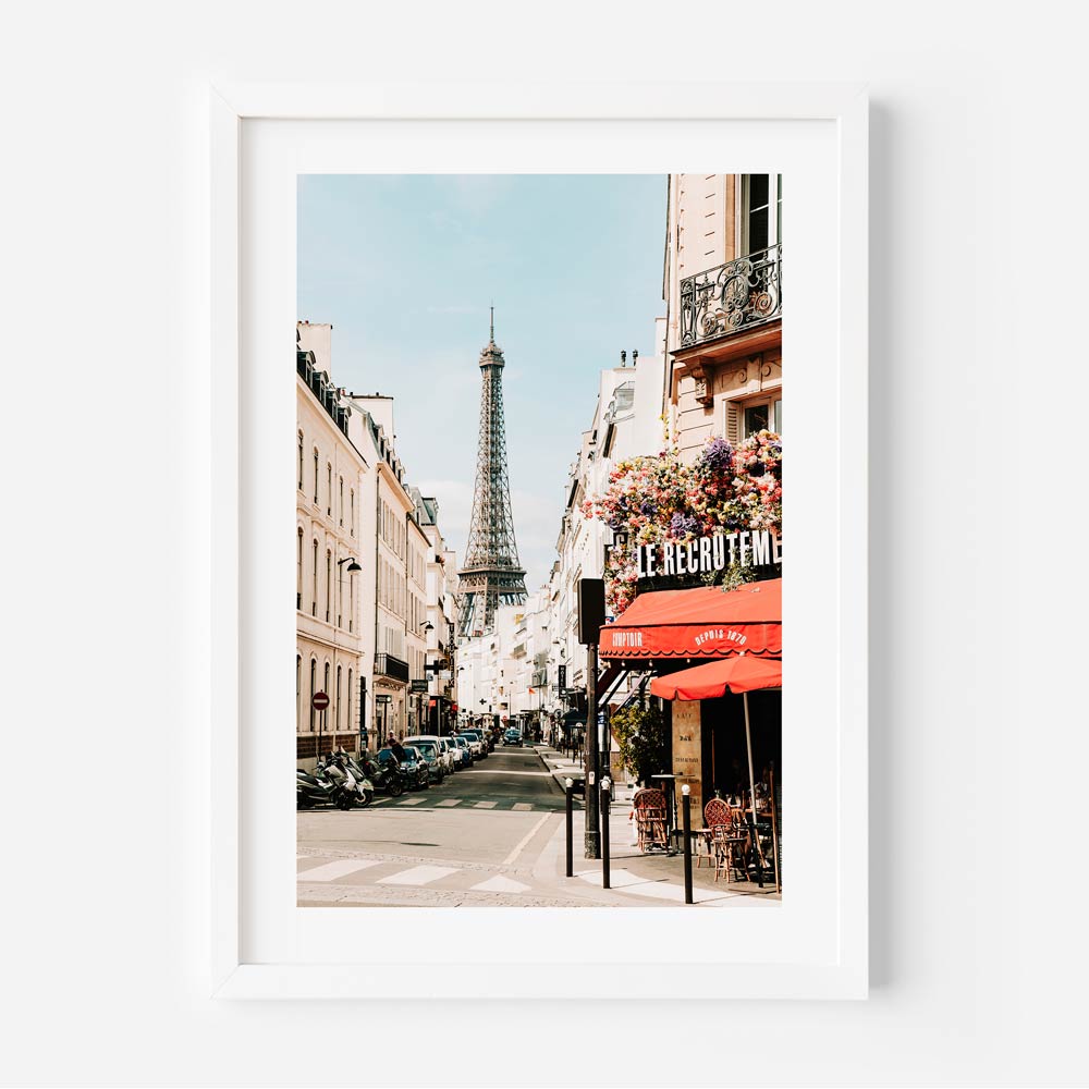 Eiffel Tower in the distance with a Parisian signboard, showcasing the iconic landmarks of the city.