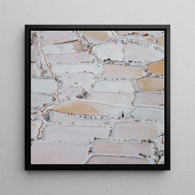 Framed abstract art print with a geometric pattern on a light gray wall.