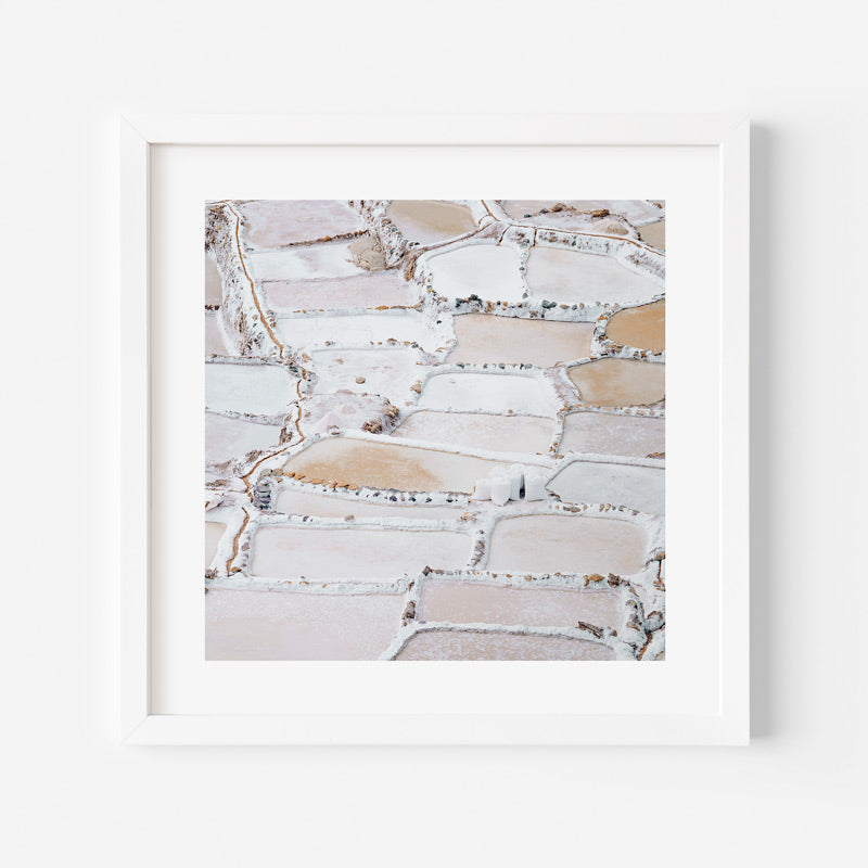 Framed abstract art print with beige and white patterns on a white background