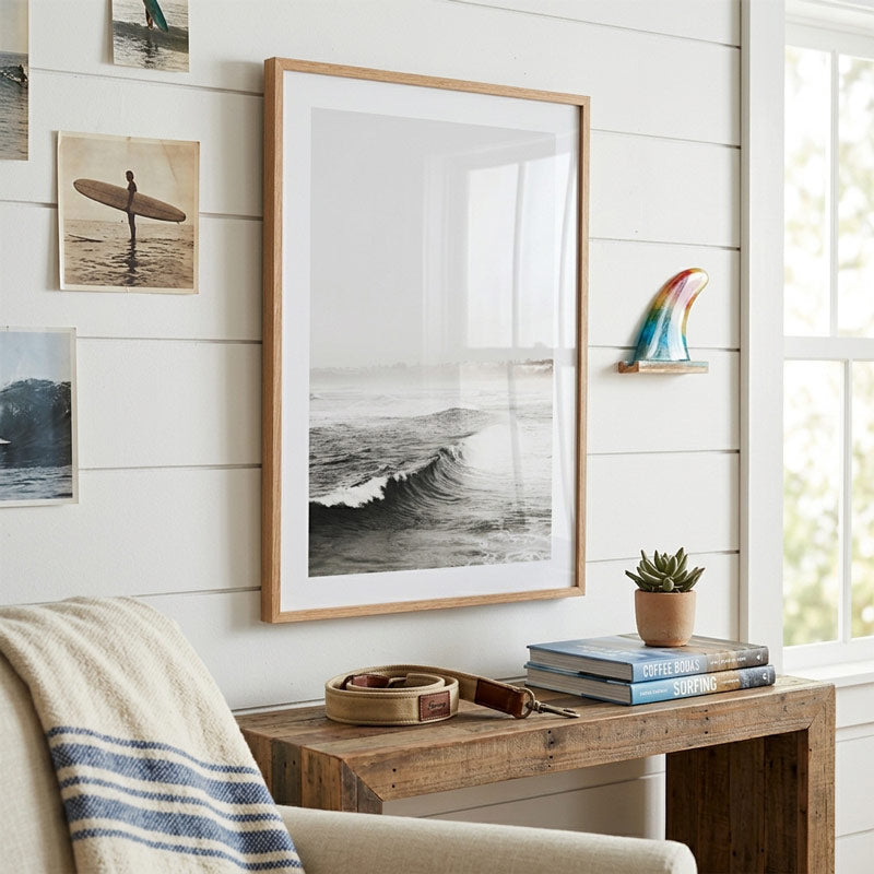 Living room with framed artwork, wooden console table, and decorative items.