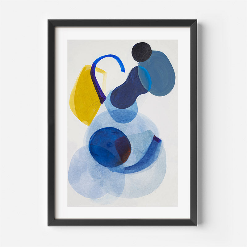Framed abstract art print with blue and yellow shapes on a light gray background