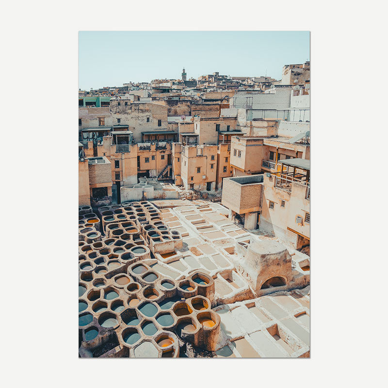 Traditional tannery with vats and buildings in a cityscape
