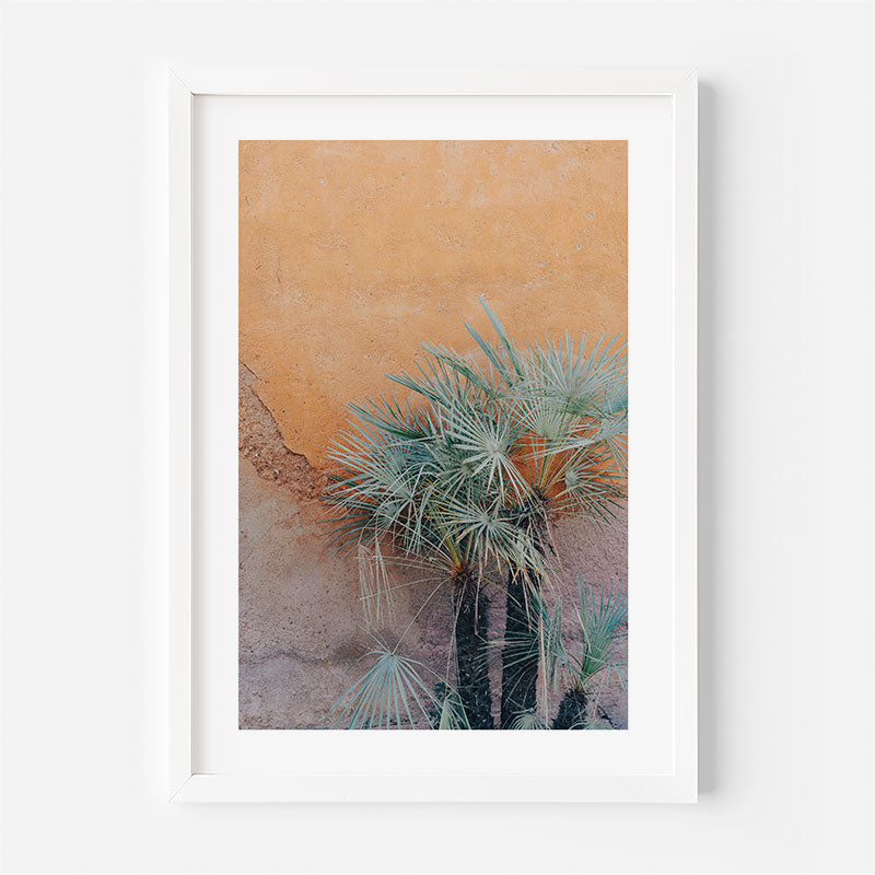 Framed artwork of a desert scene with cacti on a white background