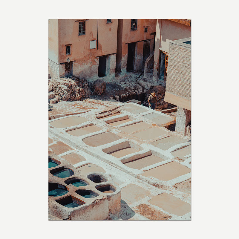 Traditional tannery with vats and buildings in the background