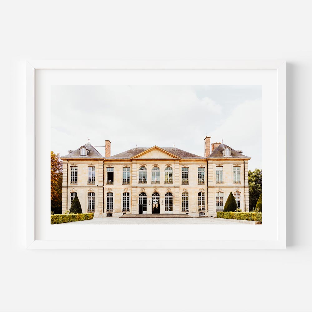 Elegant European-style building with tall glass windows and stunning facades, capturing the charm of Paris.