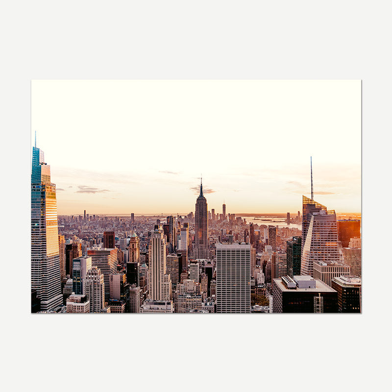 City skyline with tall buildings during sunset or sunrise.
