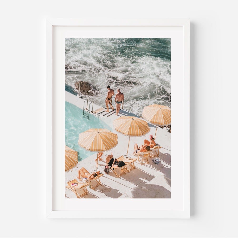 Poolside Rhythms beach wall art featuring Bondi Icebergs pool with yellow and white umbrellas and vibrant coastal colors.