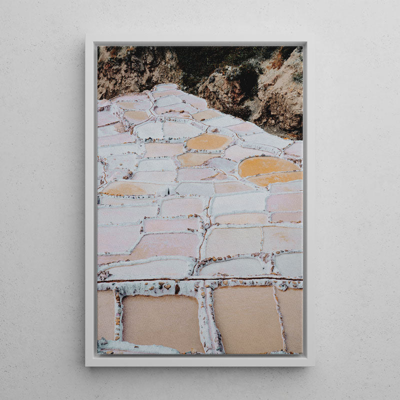 Framed artwork of a stone pathway with a textured wall background