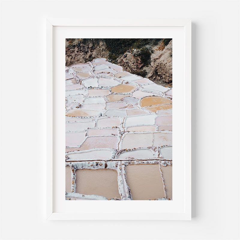 Framed photograph of a stone pathway with a white frame