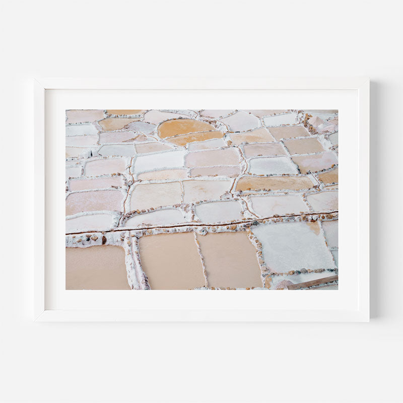 Framed artwork of a stone pavement pattern on a white background