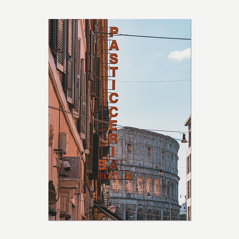 A vertical photographic print of a Rome street scene featuring the Colosseum in the background and a large orange vertical sign reading 'PASTICCERIA BAR' on the left building facade.