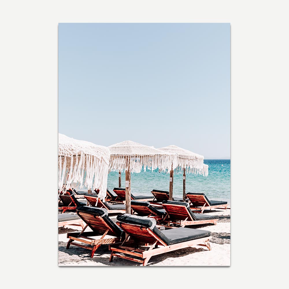 White boho style beach umbrellas and sundeck chairs in Mykonos