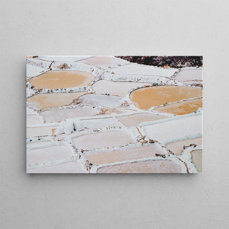 Canvas print of a natural landscape with geometric stone patterns on a gray wall.