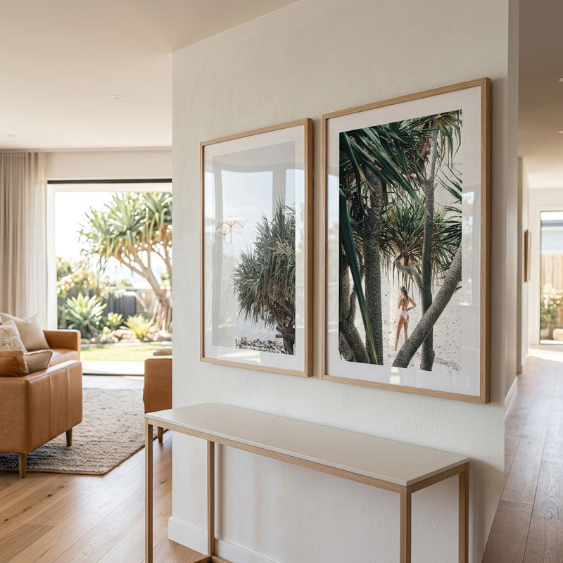 Living room with framed beach photos on a wall