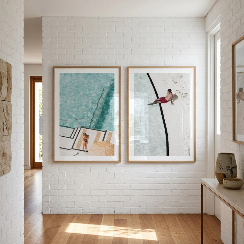 Modern interior with framed artwork on a white brick wall