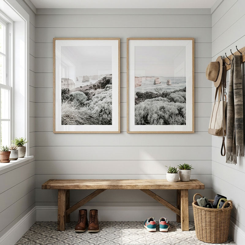 Nestled nook with wooden bench, framed pictures, and decorative items.