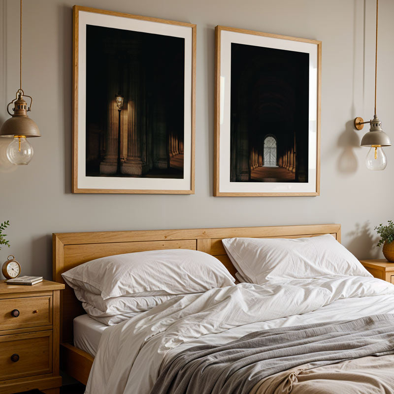 Bedroom with wooden headboard, white bedding, and framed artwork on the wall.