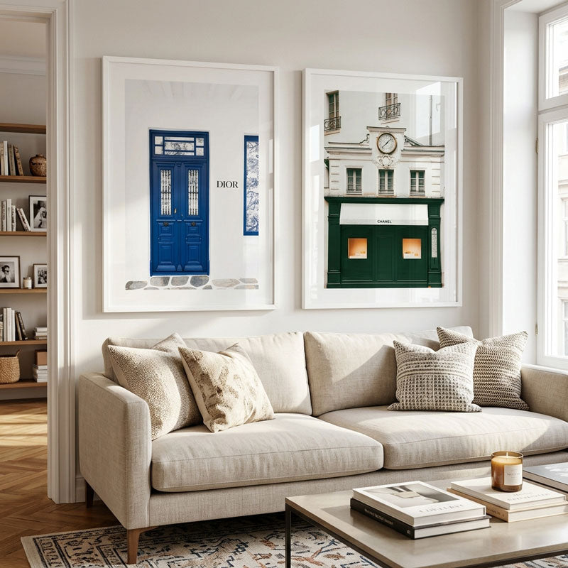 Living room with a beige sofa, coffee table, and framed pictures on the wall.
