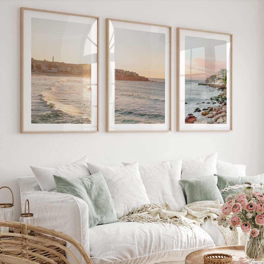 A set of 3 bondi beach wall art hung in living room.