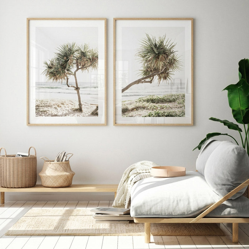 Living room with two framed beach scenes, a wooden bench, and decorative items.