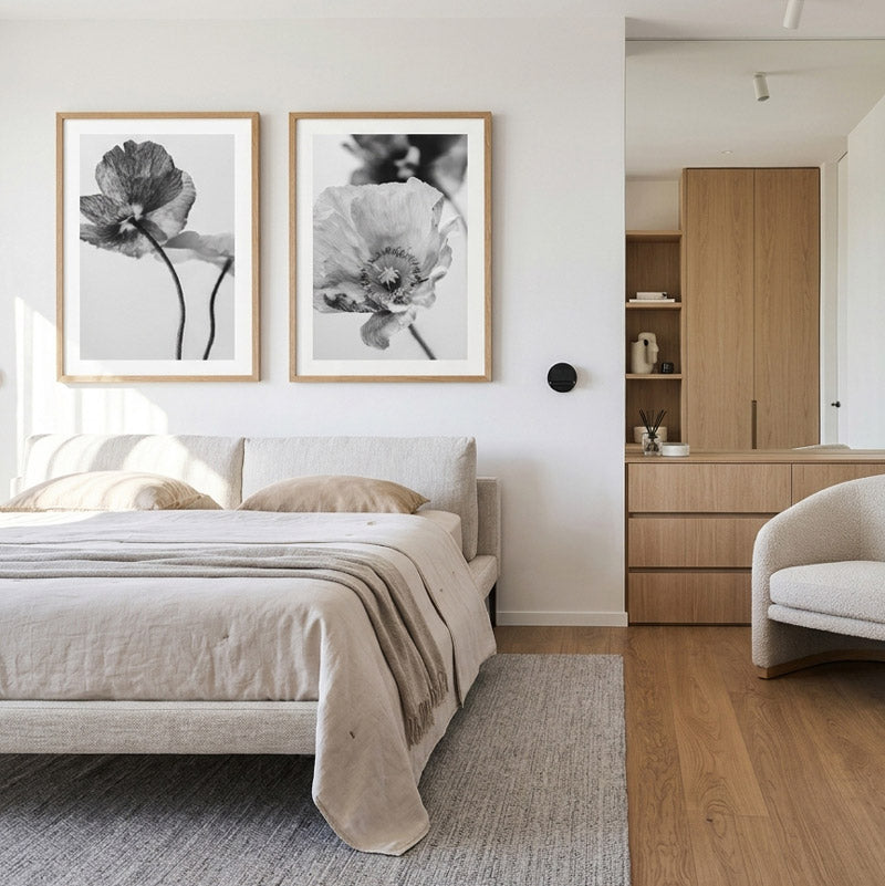 Modern bedroom with floral artwork on the wall, bed, and wooden furniture.