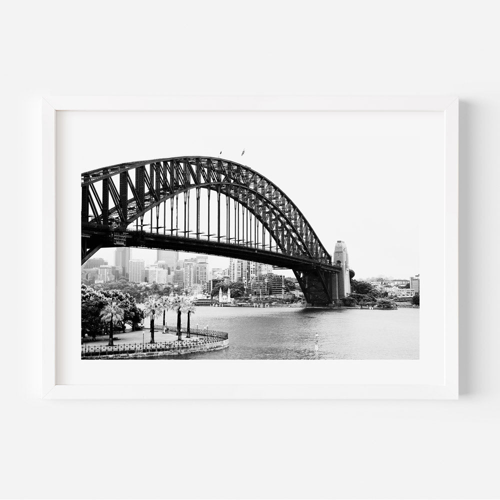 Veiled Icons wall art featuring Sydney Harbour Bridge and Luna Park emerging through mist in a black-and-white photograph.