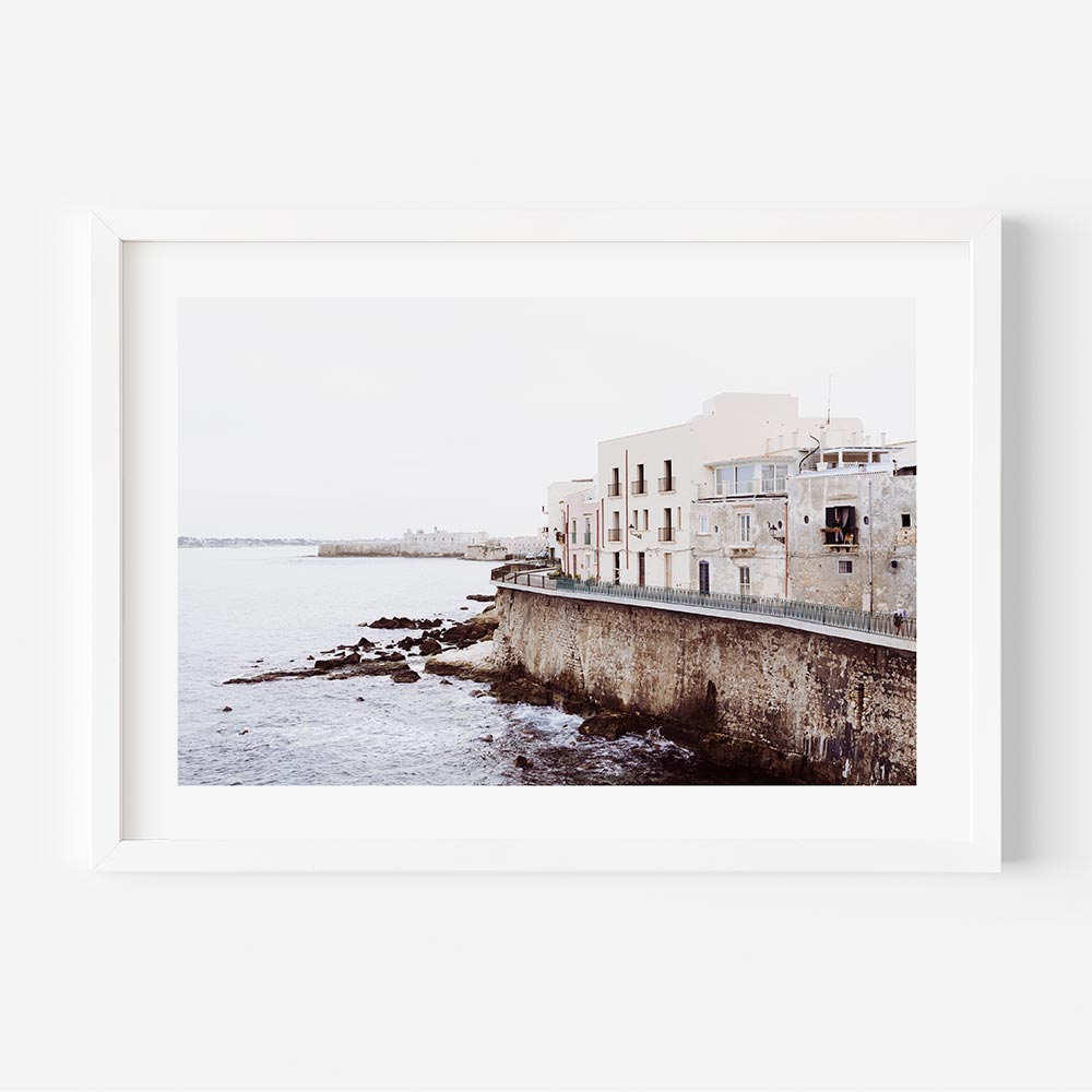 Pastel coastal buildings in Syracuse, Sicily — unique coastal wall art capturing Mediterranean architecture and beach scene wall art.