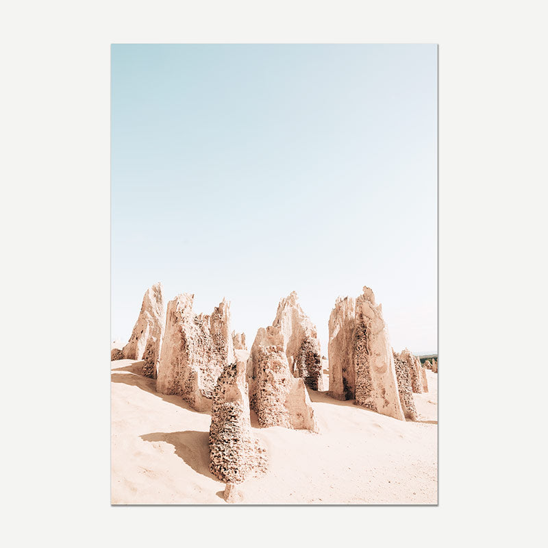 Desert landscape with rock formations under a clear blue sky