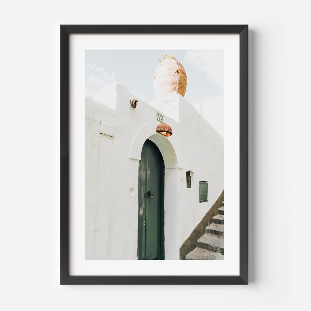 Charming beach house wall art with terracotta pot and lush cliffs—coastal artwork inspired by Amalfi.