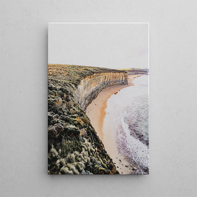 Canvas print of a coastal landscape with cliffs and beach on a gray background