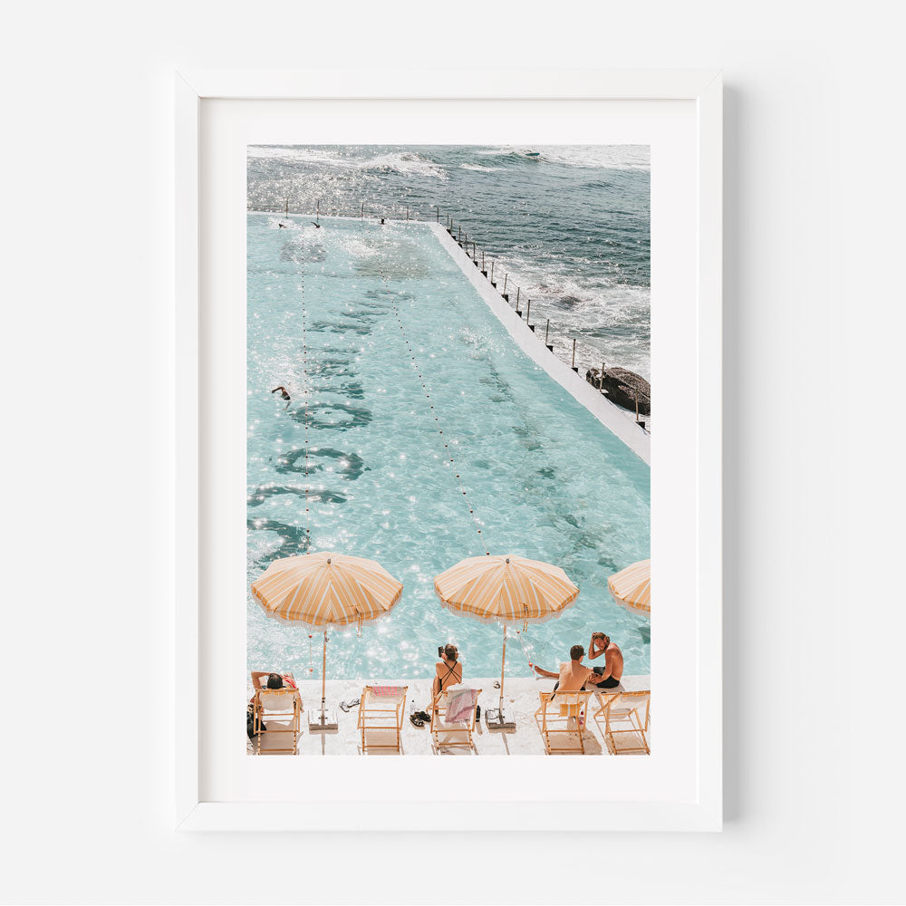 Bondi Icebergs wall artwork showcasing yellow and white umbrellas and turquoise waters for vibrant summer decor.