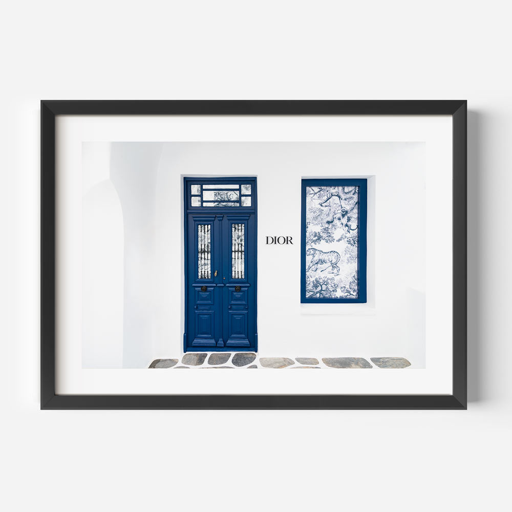 Mykonos Dior shop photographed at dawn, offering refined seaside wall art with timeless architectural charm