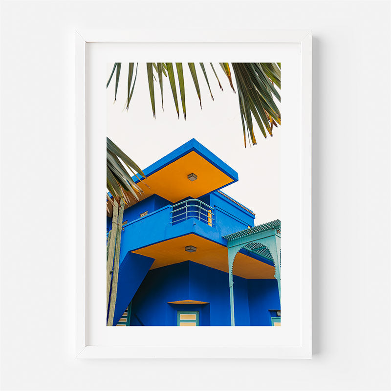 Colorful building with blue and orange architecture against a white background